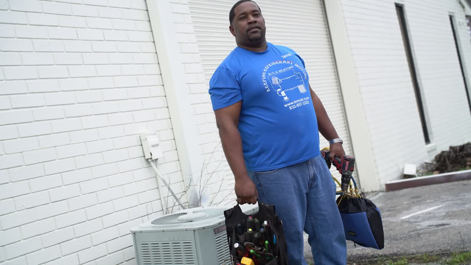 KRM technician with HVAC service equipment