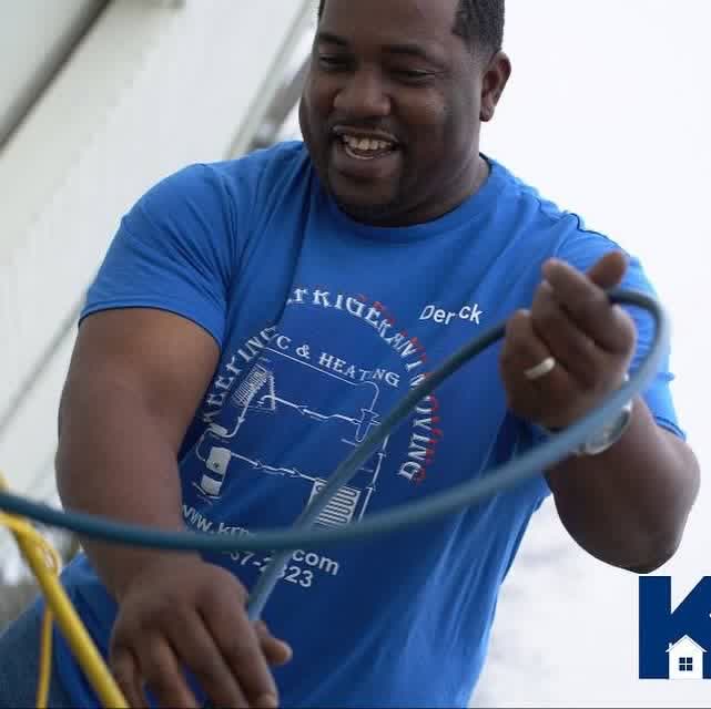 KRM technician handling HVAC service hose